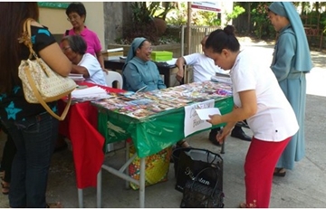 Catechist Booth selling Davao Catholic Herald and religious articles