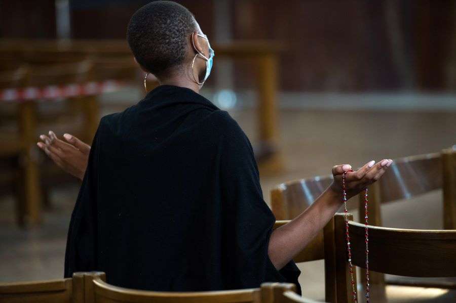 woman praying at Westminster Cathedral London