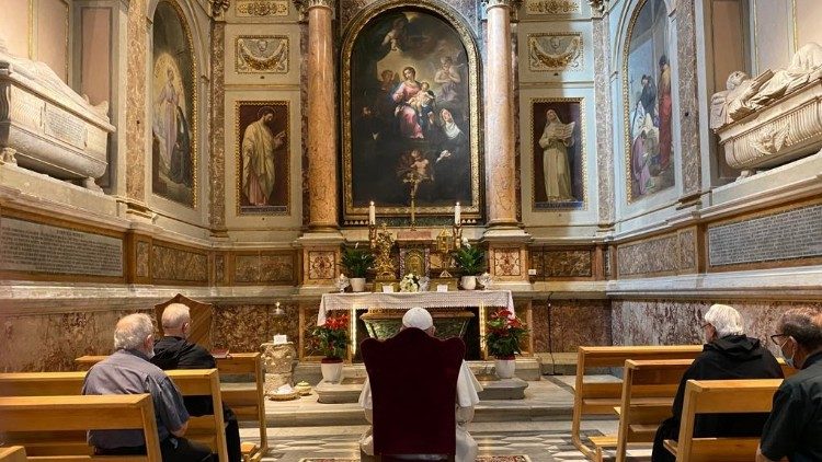 Pope Francis in prayer before the tomb of St Monica