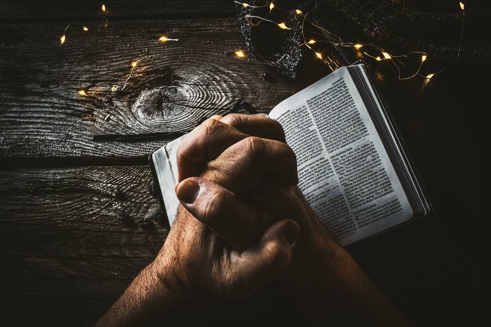 timothy eberly stock prayer bible hands unsplash