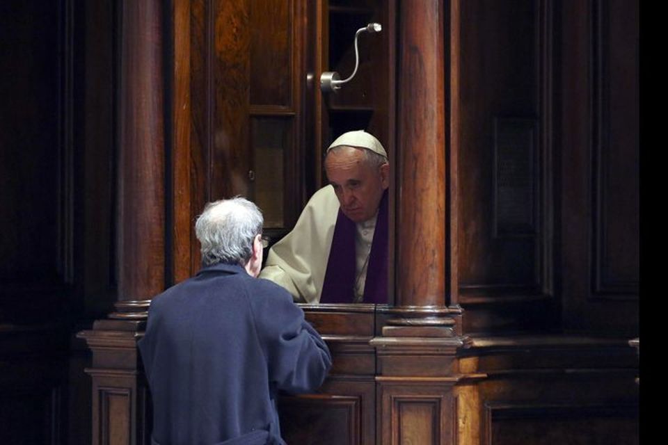 Pope Francis hearing confession