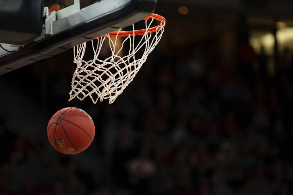 Ball under basketball ring by Markus Spiske on unsplash