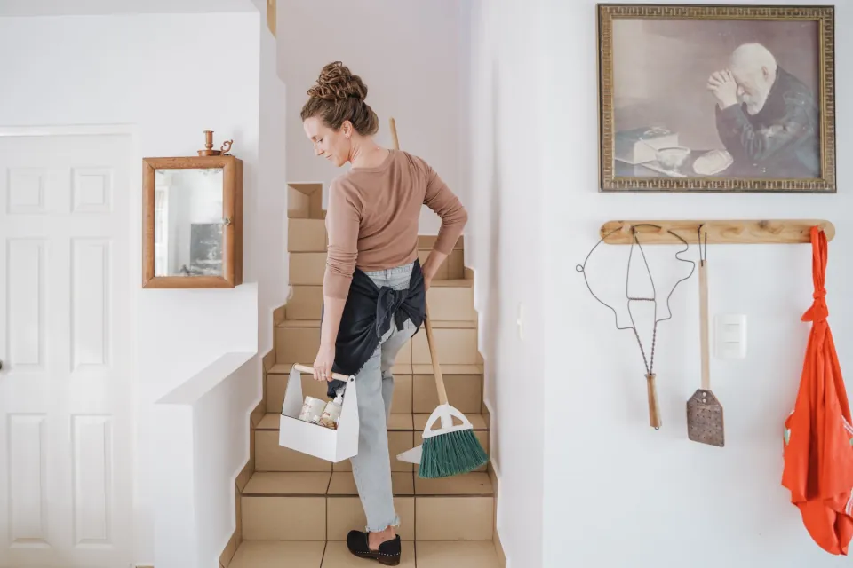 Woman cleaning house stock photo by Josue Michel on unsplash