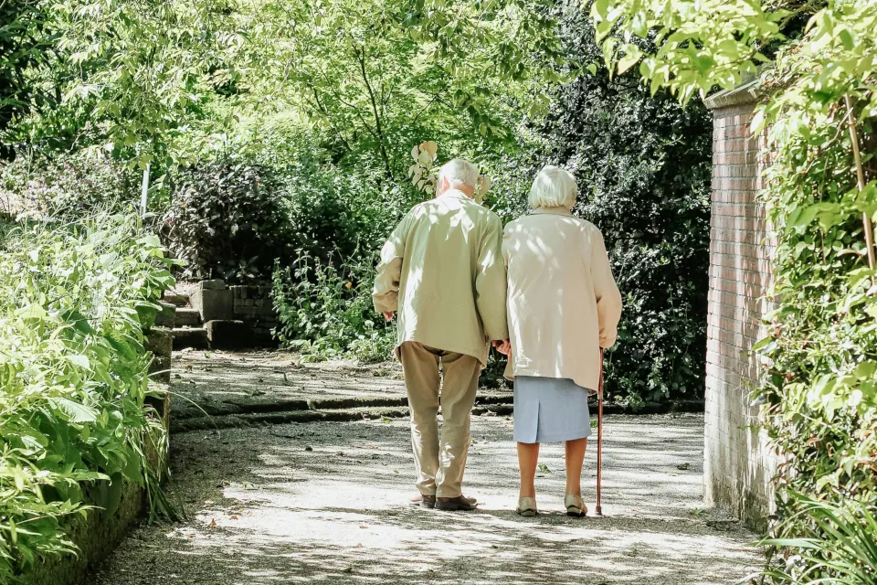 Elderly couple walking stock photo by Micheile Henderson on unsplash